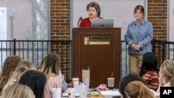 Preservice teachers listen as Alabama Education Association representatives Linda Shirley, left and Tracy Moore discuss the AEA's mission and value at an ethics seminar provided by the Athens State college of education on Oct. 11, 2022, in Athens, Ala. (AP Photo/Vasha Hunt)