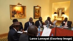 Negotiators at South Sudan peace talks in Addis Ababa review a draft cessation of hostilities agreement on Jan. 13, 2014.