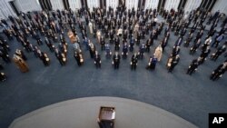 FILE - Syrian President Bashar al-Assad addresses the parliament, in Damascus, Syria, Aug. 12, 2020.