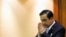 FILE - Thai Army chief General Prayuth Chan-ocha gestures in a traditional greeting during the start of a National Legislative Assembly meeting, Bangkok, August 2014.