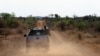 FILE - Anti-rhino poaching troops simulate a hunt for poachers in the Madikwe Game Reserve, Botswana, Nov. 8, 2013. Botswana's wildlife authorities say four rhinoceroses recently were shot at the country's protected Khama Rhino Sanctuary.
