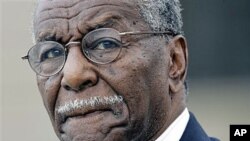 In this June 2007 file photo, Civil rights activist the Rev. Fred Shuttlesworth departs the Federal Courthouse in Montgomery, Alabama.