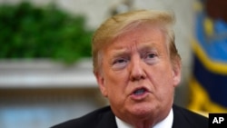 FILE - President Donald Trump speaks in the Oval Office of the White House in Washington, March 27, 2019. 