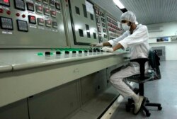 FILE - In this Feb. 3, 2007 file photo, an Iranian technician works at the Uranium Conversion Facility just outside the city of Isfahan, Iran, 255 miles (410 kilometers) south of the capital Tehran. (AP)