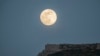 The moon rises above the castle of Acrocorinth, the acropolis of ancient Corinth, about 80 kilometers southwest of Athens on May 6, 2020.
