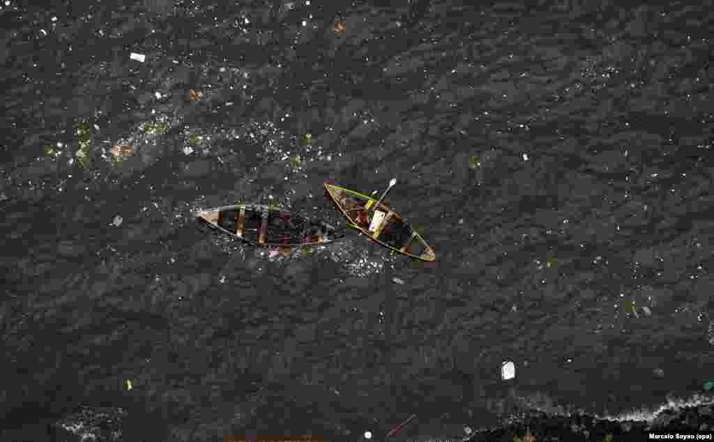Fishermen are seen in polluted Guanabara Bay, where the Sailing competitions at the 2016 Rio Olympic Games will be held, in Rio de Janeiro, Brazil.