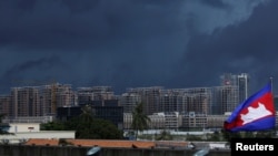 FILE: Buildings under construction are pictured beneath dark clouds in Phnom Penh, Cambodia, June 18, 2018.