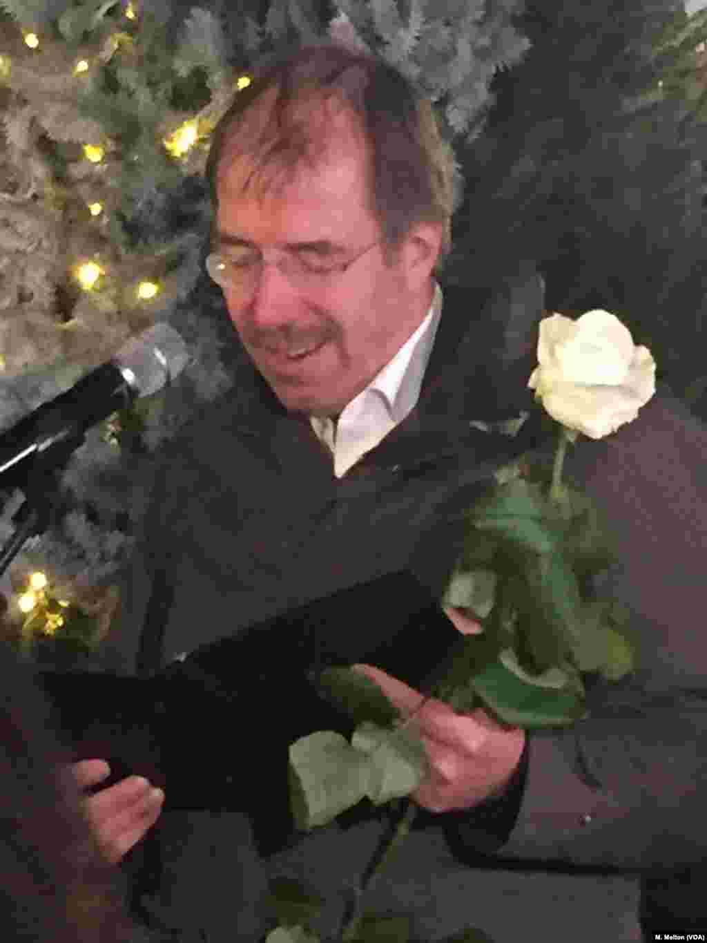 Martin Germer, pastor of the Kaiser Wilhelm Memorial Church, reads a tribute to the victims of the Dec. 19, 2016, attack as Berlin's Christmas markets open on Nov. 27, 2017.