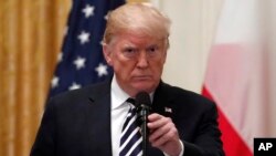 President Donald Trump holds a news conference with Polish President Andrzej Duda in the East Room of the White House, Sept. 18, 2018. 