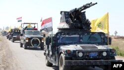 Members of the Iraqi security forces heading from the city of Samarra, north of Baghdad, toward the al-Dawr area, south of Tikrit, to launch an assault against the Islamic State group, Feb. 28, 2015. 