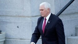Vice President Mike Pence walks to the West Wing of the White House after addressing staff on the steps of the Eisenhower Executive Office Building, Jan. 19, 2021, in Washington.