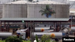 A child drinks water at a camp in Palu in Indonesia&#39;s Central Sulawesi province, following the September 28 earthquake and tsunami.