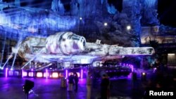 Guests explore "Star Wars: Galaxy's Edge" near a Millennium Falcon starship at Disneyland Park in Anaheim, California, U.S., May 29, 2019.