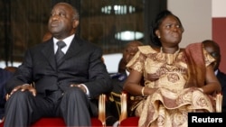 FILE - Ivory Coast President Laurent Gbagbo and his wife Simone Ehivet Gbagbo attend a memorial ceremony at Felix Houphouet Boigny stadium in Abidjan.