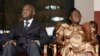 FILE - Laurent Gbagbo and his wife Simone Ehivet Gbagbo attend a memorial ceremony at Felix Houphouet Boigny stadium in Abidjan.