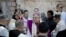 Latin Patriarch of Jerusalem Fouad Twal, center, arrives at the Church of the Nativity, built atop the site where Christians believe Jesus Christ was born, on Christmas Eve, in the West Bank City of Bethlehem, Thursday, Dec. 24, 2015.