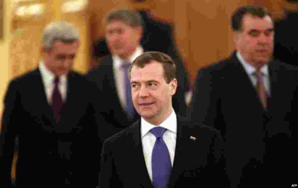 Russian President Dmitry Medvedev, front, enters a hall before a summit of the Collective Security Treaty Organization in the Kremlin in Moscow, Tuesday, Dec. 20, 2011. (AP Photo/Yuri Kochetkov, Pool)