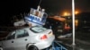 Vehicles and boats lie on the shore after a tsunami hit the northern port of Iquique, Chile, following an 8.2-magnitude earthquake, April 2, 2014.