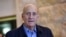 Former Israeli Prime Minister Ehud Olmert speaks to the press in the Supreme Court after the court reduced his sentence from six years to 18 months in prison in the Holyland corruption case in Jerusalem, Dec. 29, 2015.