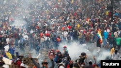 People participate in a demonstration against Ecuador's President Lenin Moreno's austerity measures in Quito, Ecuador, Oct. 11, 2019. 
