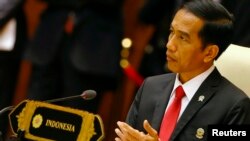 FILE - Indonesia's President Joko Widodo, shown at an ASEAN summit meeting last year in Myanmar, says there have been "no thoughts" of a government apology to victims of the response to a failed coup by the September 30th Movement in 1965.