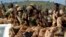 FILE - Chadian soldiers are seen sitting atop a pickup truck.