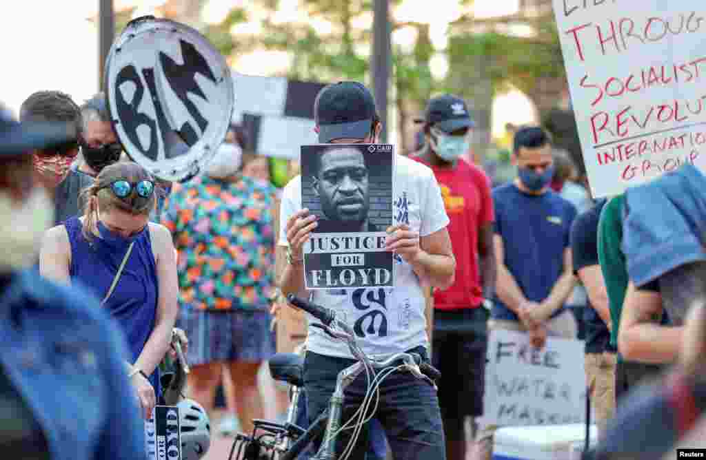 People gather outside the Hennepin County Government Center for a moment of silence for the death of George Floyd, an unarmed black man, arrested by police officers in Minneapolis, Minnesota.