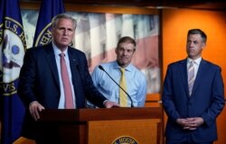 House Minority Leader Kevin McCarthy, R-Calif., announces the withdrawal of his nominees to serve on a special committee probing the Jan. 6 attack on the Capitol, July 21, 2021, as Reps. Jim Jordan of Ohio, center, and Jim Banks of Indiana stand by.