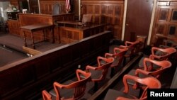 FILE -- A view of the jury box (front), where jurors would sit in and look towards the judge's chair (C), the witness stand (R) at the New York Supreme Court.