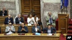 A person jumps on a trampoline before Nathan's Famous Fourth of July International Hot Dog-Eating Contest at Coney Island in Brooklyn, New York.