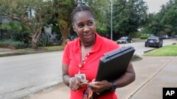 Deneshun Graves, a disease intervention specialist with the Houston Health Department, walks to a client's residence for a visit in Houston onOct. 26, 2023. “When you have a mother who didn’t know (she had syphilis), it can be very emotional trying to explain,” says Graves. 