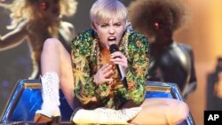 Singer Miley Cyrus performs in concert during her ‘Bangerz Tour’ at the Verizon Center on Thursday, April 10, 2014 in Washington D.C. 