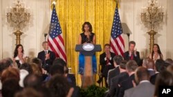First lady Michelle Obama speaks at a Joining Forces initiative event to announcing "The Mayors Challenge to End Veteran Homelessness" program, in the East Room of the White House in Washington, June 4, 2014.