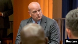 FILE - Matthew Whitaker attends a discussion with foreign liaison officers at the Justice Department in Washington, Aug. 29, 2018.