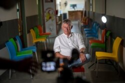 In this photograph taken Thursday May 21, 2020, Dr. Hugo Tempelman sits for an interview at a clinic in the Moutse Valley, 160 kms (100 miles) north east of Johannesburg, South Africa. Tempelman is the founder of the Ndlovu Youth Choir. Finalists of…