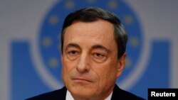 Mario Draghi, President of the European Central Bank (ECB) arrives for the ECB's monthly press conference in Frankfurt, Nov. 6, 2014.
