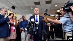 Republican presidential candidate Donald Trump speaks to supporters during a rally at the TD Convention Center, Aug. 27, 2015, in Greenville, S.C. (AP Photo/Richard Shiro)