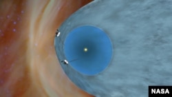 This artist's concept shows NASA's two Voyager spacecraft exploring a turbulent region of space known as the heliosheath, the outer shell of the bubble of charged particles around our sun. (NASA/JPL-Caltech)