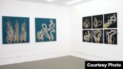 Several of Taiye Idahor's Hairvolution sculptures hang on the walls of a Lagos gallery. (Courtesy Bola Oguntade, Poseidon Images)