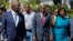 FILE - Haiti's President Jovenel Moise, center, walks with first lady Martine Moise and his Defense Minister Herve Denis, left, during a ceremony presenting the leadership of the newly reinstated Haitian Armed Forces (FAd'h) in Port-au-Prince, Haiti.