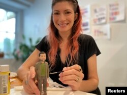 Alyssa Zeller Feinberg, FCTRY chief design officer, with a prototype of the Zelenskiy action figure in Brooklyn, NY, August 9, 2022. (REUTERS/Roselle Chen)