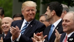 President Donald Trump talks with House Speaker Paul Ryan of Wis., in the Rose Garden of the White House in Washington, May 4, 2017, after the House pushed through a health care bill. 