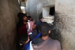 Syrians buy bread at a shop in the town of Binnish in the country's northwestern Idlib province on June 9, 2020.