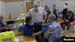 BRITISH PRIME MINISTER BORIS JOHNSON VISITING A VACCINATION CENTRE IN CENTRAL LONDON