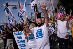 FILE - Pro-Israel supporters chant slogans during a rally in support of Israel outside the Federal Building in Los Angeles, May 12, 2021.