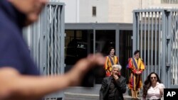Pietro Orlandi, brother of Emanuela Orlandi who when missing in 1983, walks with his lawyer Laura Sgro after the Vatican reopened two tombs in the Teutonic Cemetery inside the Vatican, July 11, 2019
