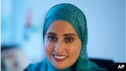 This undated image released by the Emirates News Agency, WAM, shows Ohood Al Roumi, the Minister of State for Happiness of the United Arab Emirates.