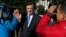 Paul Manafort makes his way through television cameras as he walks from Federal District Court in Washington, Oct. 30, 2017. 