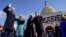 Joe Biden is sworn in as the 46th president of the United States by Chief Justice John Roberts as Jill Biden holds the Bible during the 59th Presidential Inauguration at the U.S. Capitol.