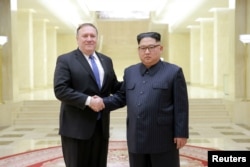 North Korean leader Kim Jong Un shakes hands with U.S. Secretary of State Mike Pompeo in this undated photo released on May 9, 2018 by North Korea's Korean Central News Agency (KCNA) in Pyongyang.